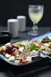 Photo of Delicious salad with beef tongue, cheese and fork served on table. Space for text