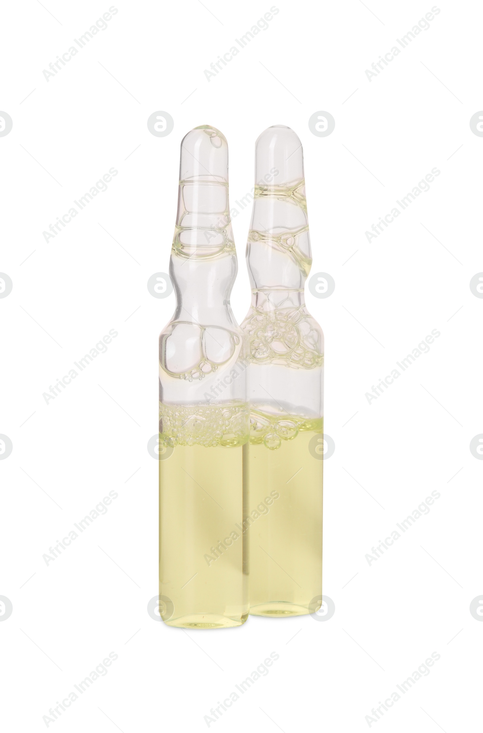 Photo of Glass ampoules with liquid isolated on white