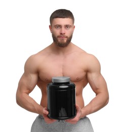 Young man with muscular body holding jar of protein powder on white background
