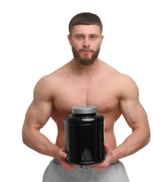 Photo of Young man with muscular body holding jar of protein powder on white background