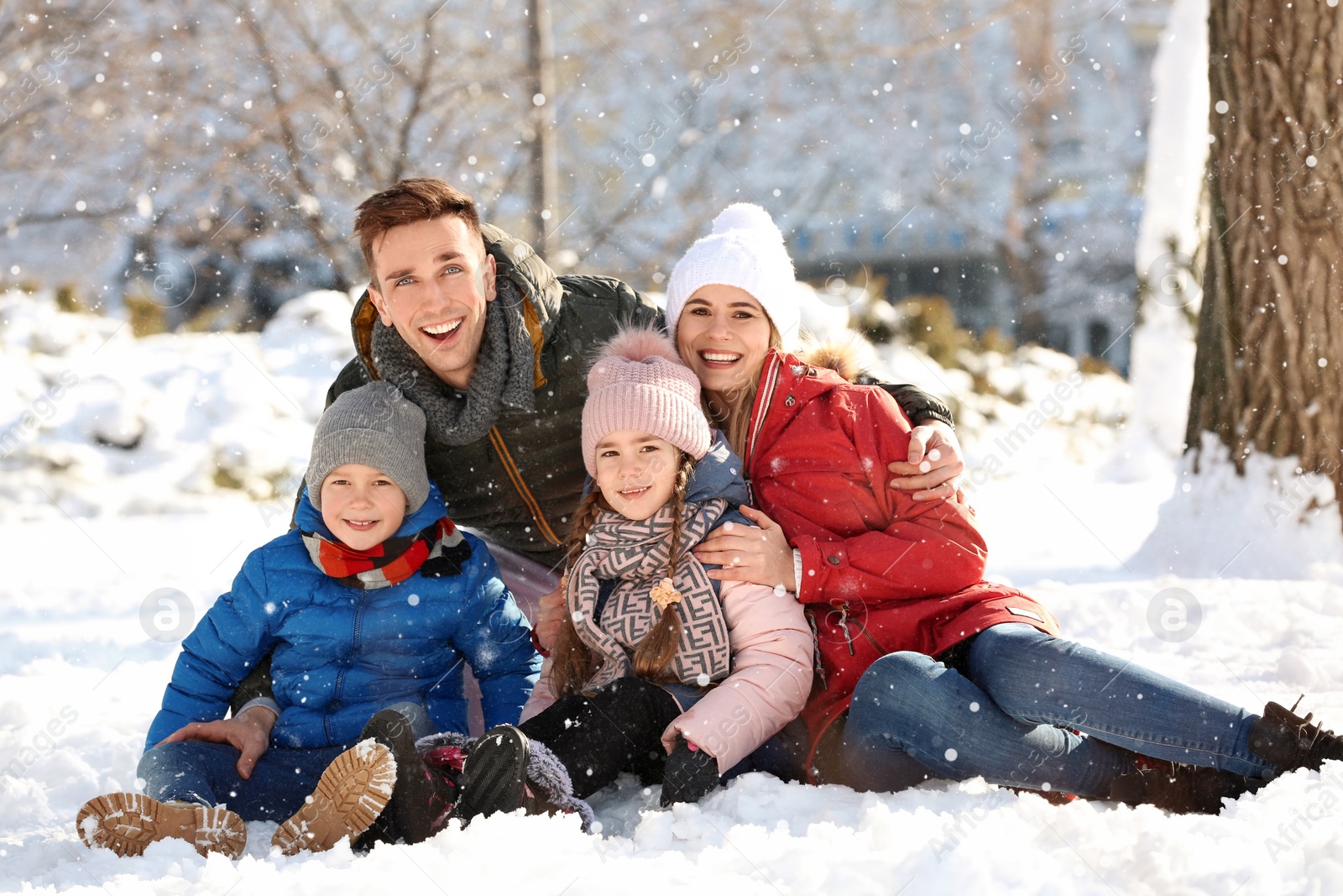 Photo of Portrait of happy family in winter park