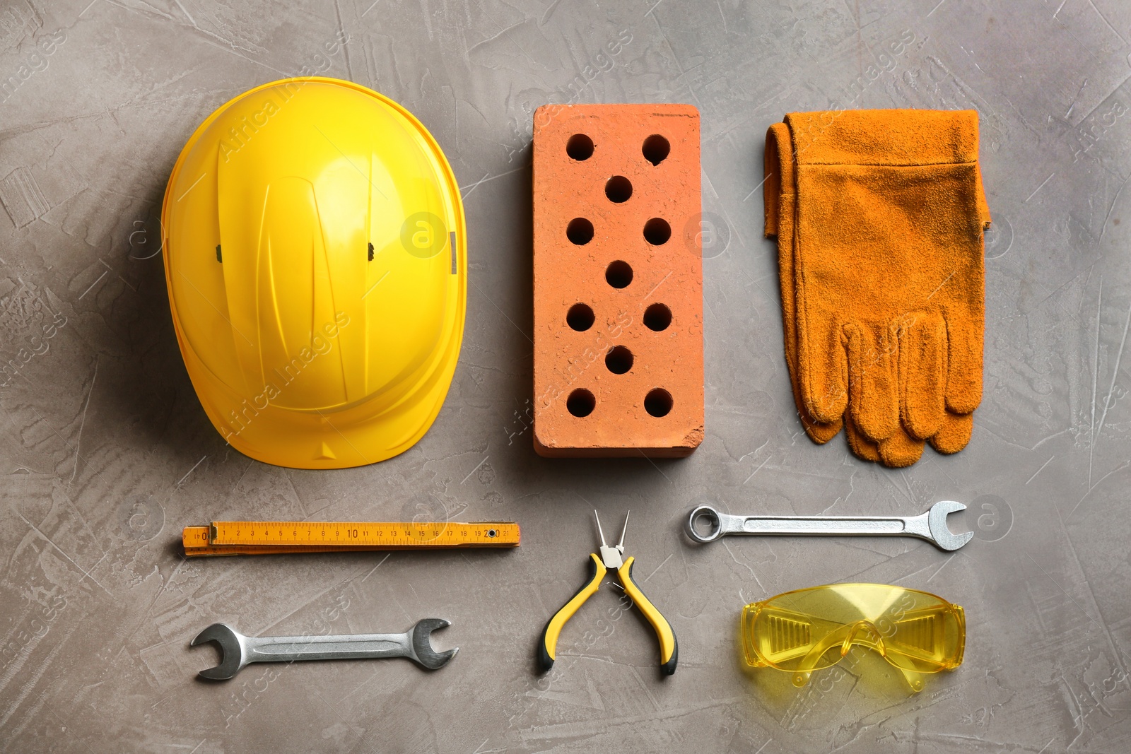 Photo of Flat lay composition with different construction tools on color background