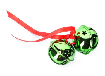 Photo of Shiny green sleigh bells with ribbon isolated on white, top view