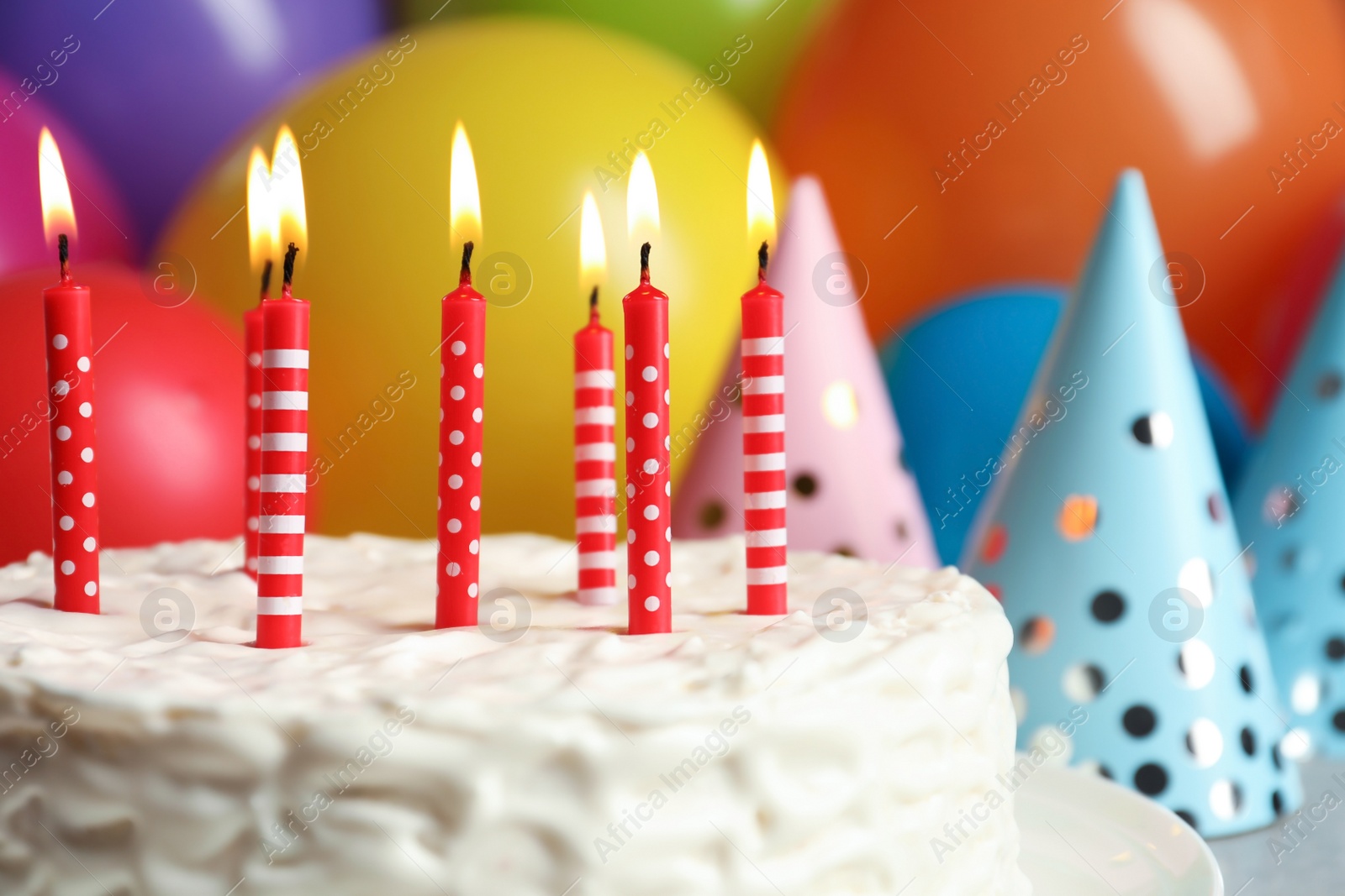 Photo of Delicious birthday cake with burning candles, closeup