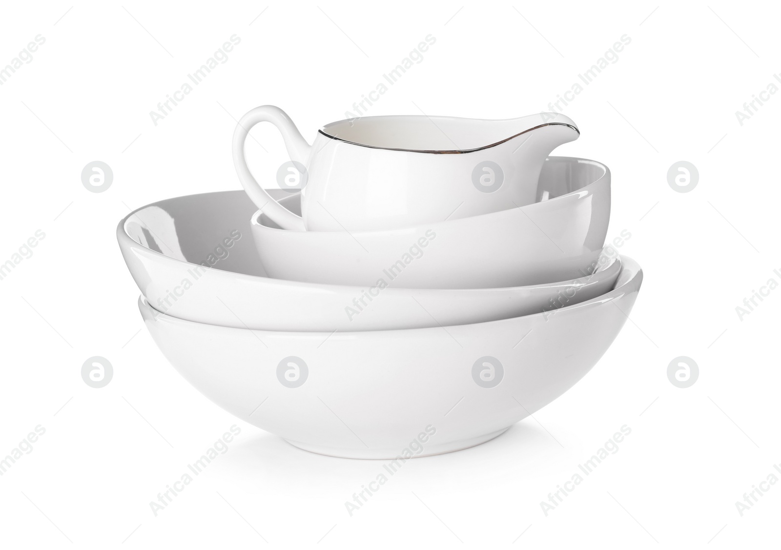 Photo of Stack of ceramic bowls with jug on white background