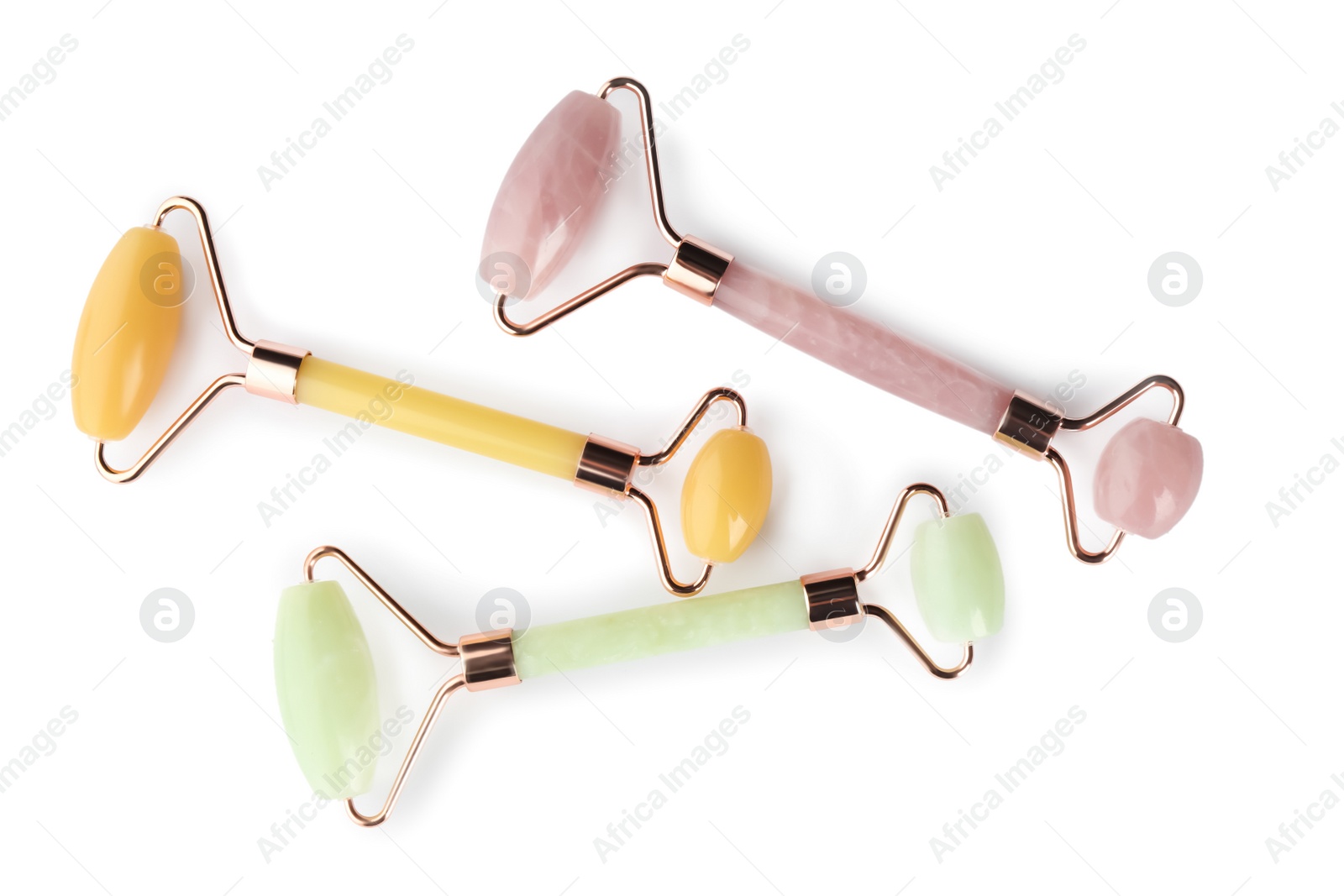Photo of Different natural face rollers on white background, top view