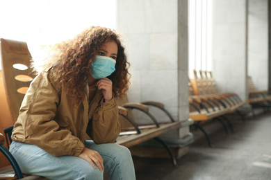 Photo of African-American woman with disposable mask indoors. Virus protection