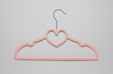 Photo of Empty clothes hanger on white background, top view
