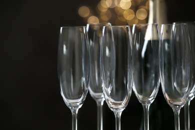 Photo of Empty champagne glasses on blurred background, closeup