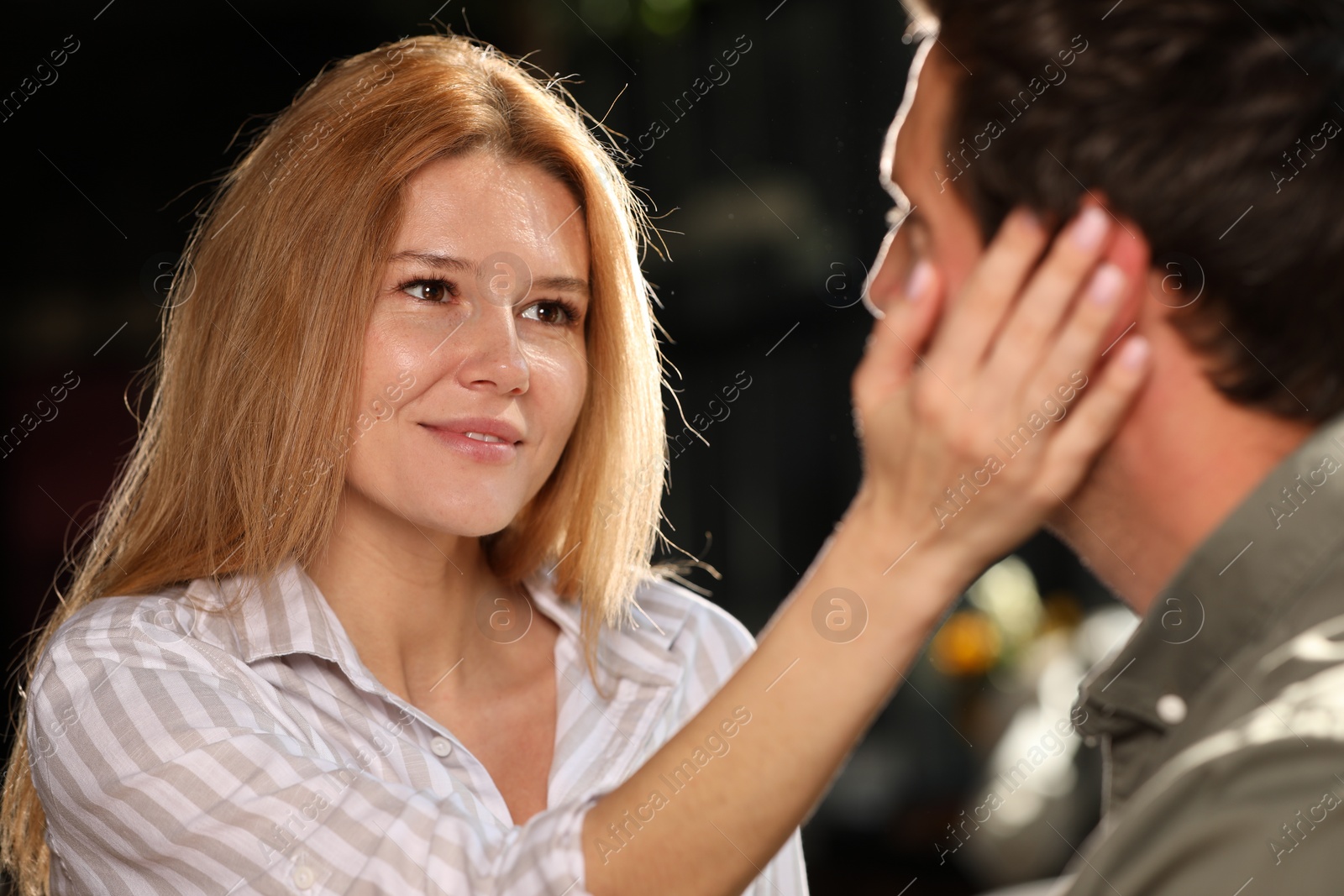 Photo of Romantic date. Lovely couple spending time together on blurred background