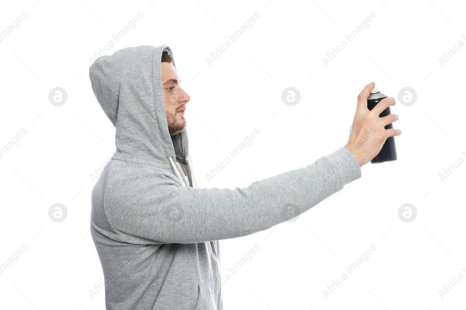 Photo of Handsome man holding can of black spray paint against white background