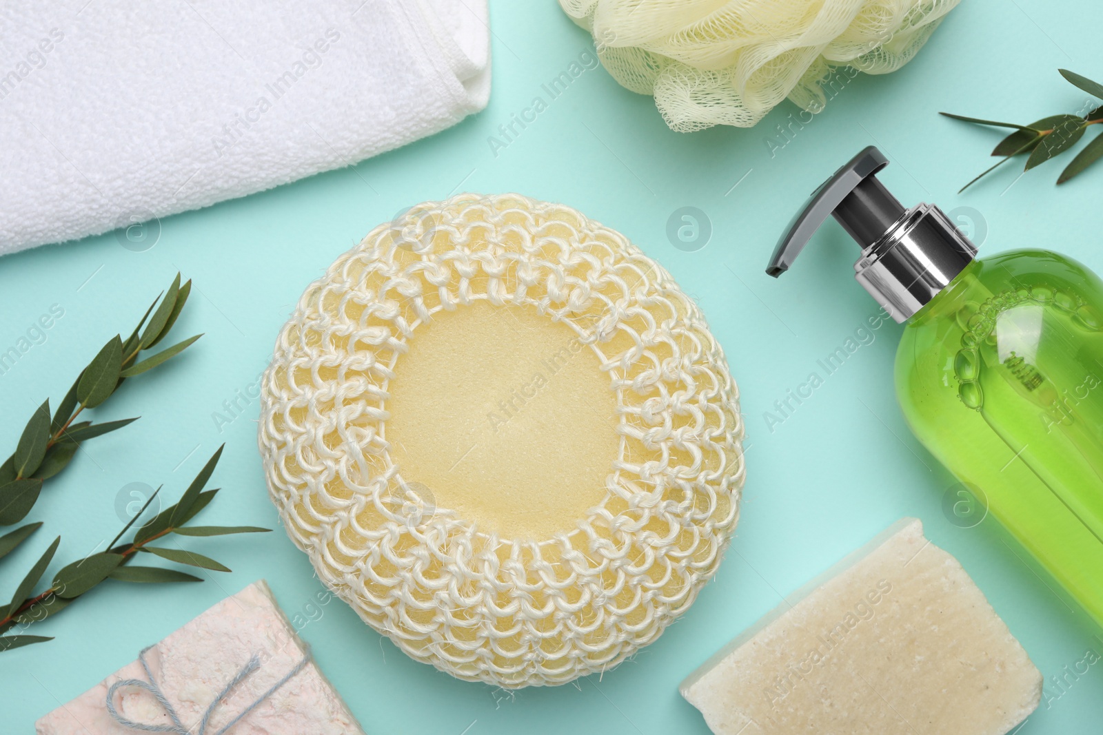 Photo of Flat lay composition with bath sponge on light blue background