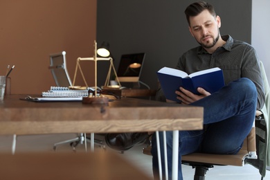 Photo of Male lawyer working in office