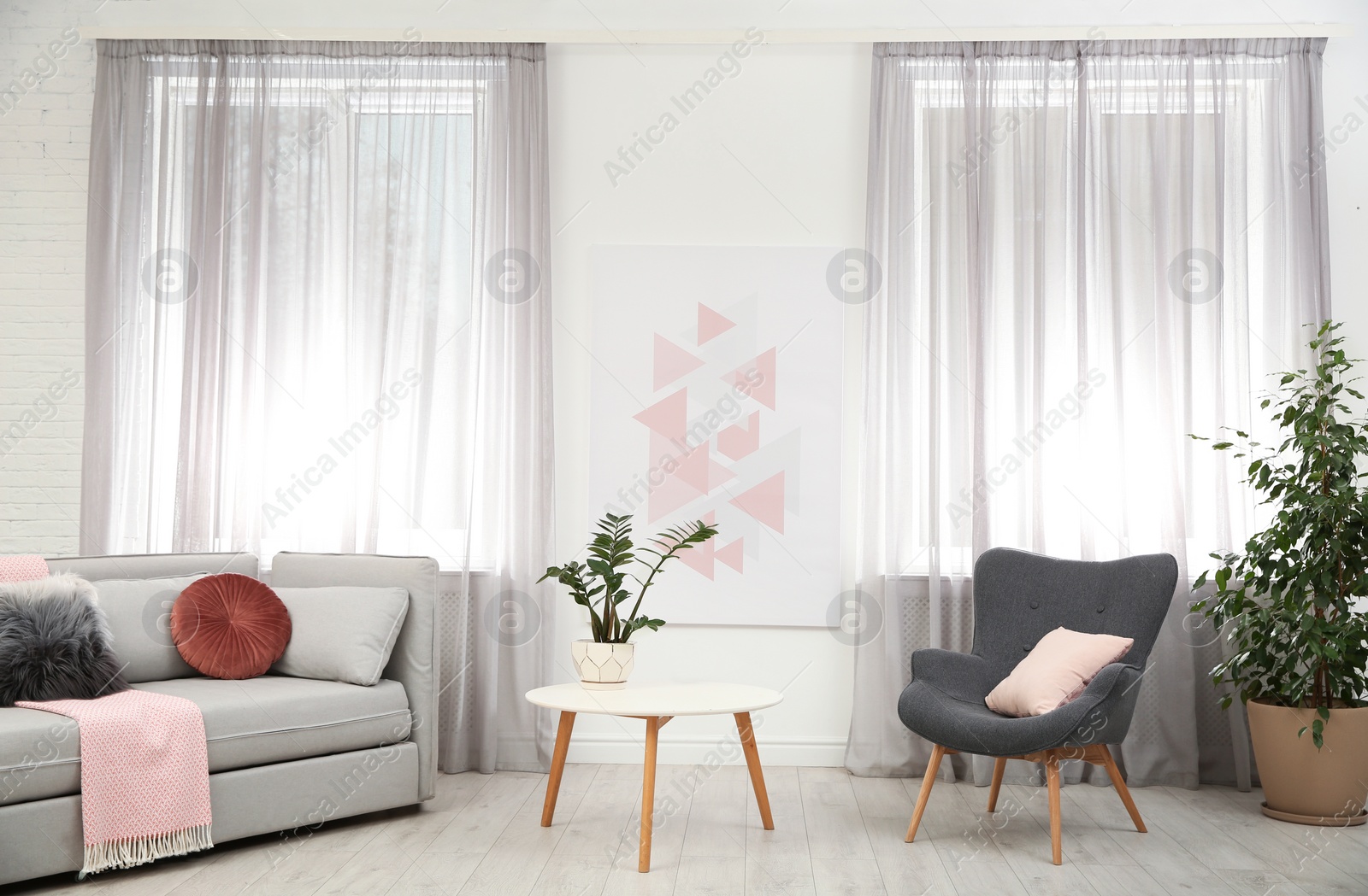 Photo of Modern furniture and window curtains in stylish room interior