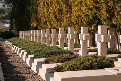 Photo of Many granite tombstones at cemetery. Religious tradition