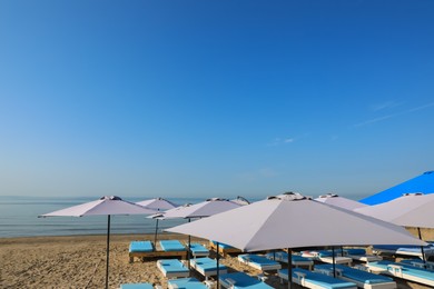 Many beach umbrellas and sunbeds at resort