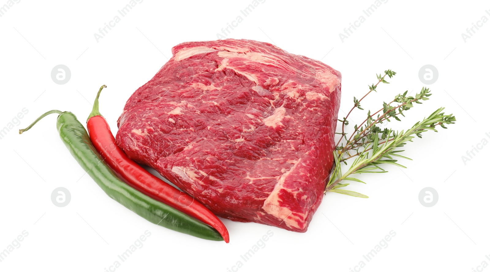 Photo of Fresh raw beef cut, herbs and peppers isolated on white