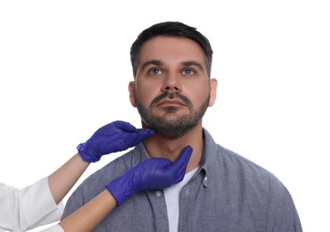 Photo of Endocrinologist examining thyroid gland of patient on white background, closeup