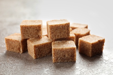 Cubes of brown sugar on table