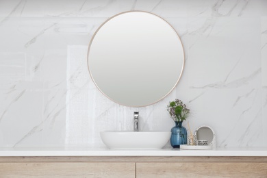 Modern bathroom interior with stylish mirror and vessel sink