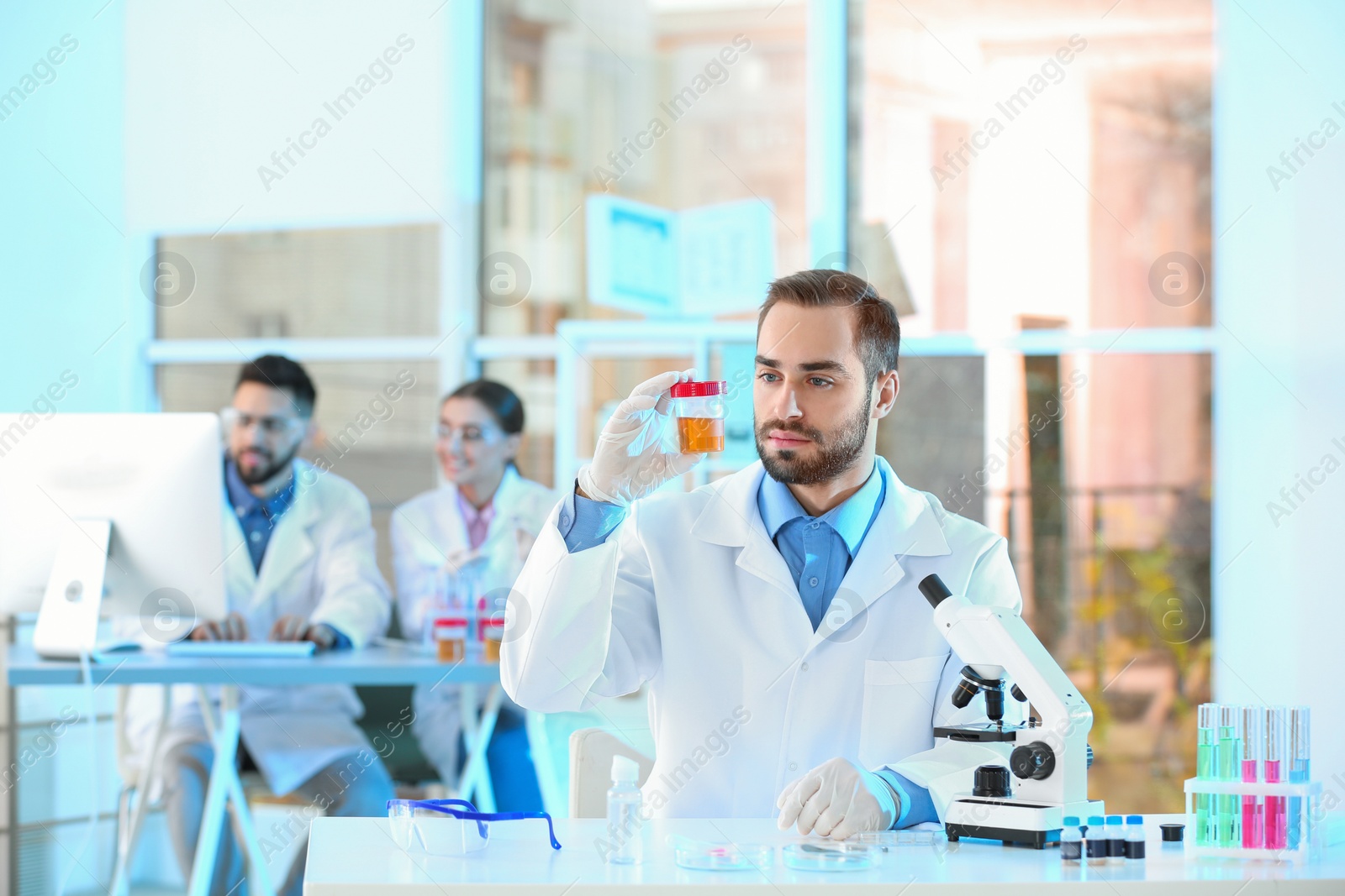 Photo of Young scientist working in laboratory. Chemical analysis