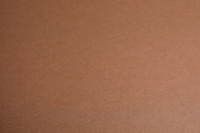 Photo of Brown sheet of cardboard as background, closeup