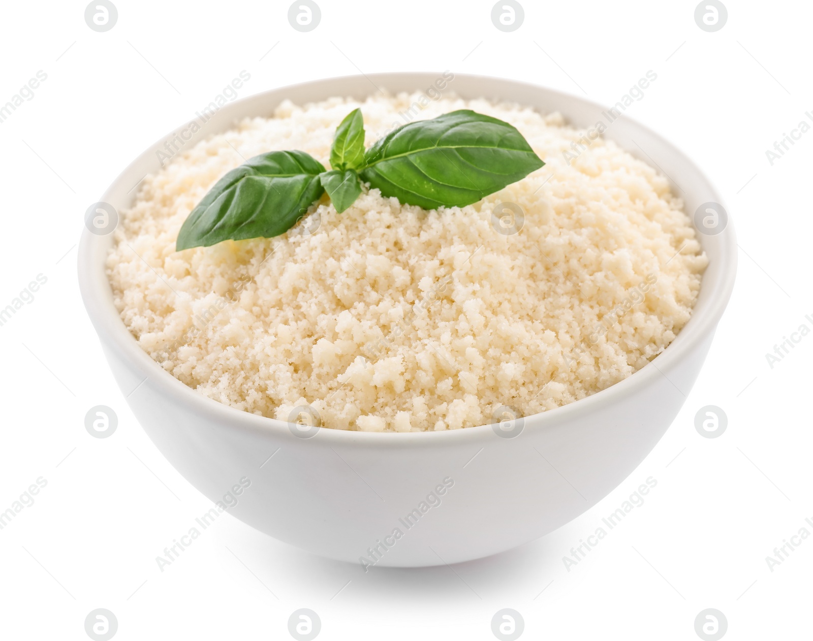 Photo of Bowl with grated parmesan cheese and basil isolated on white