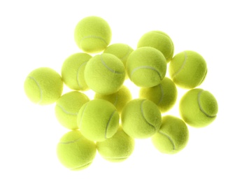 Photo of Heap of tennis balls on white background, top view. Sports equipment