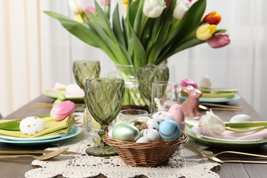 Photo of Festive table setting with beautiful flowers. Easter celebration