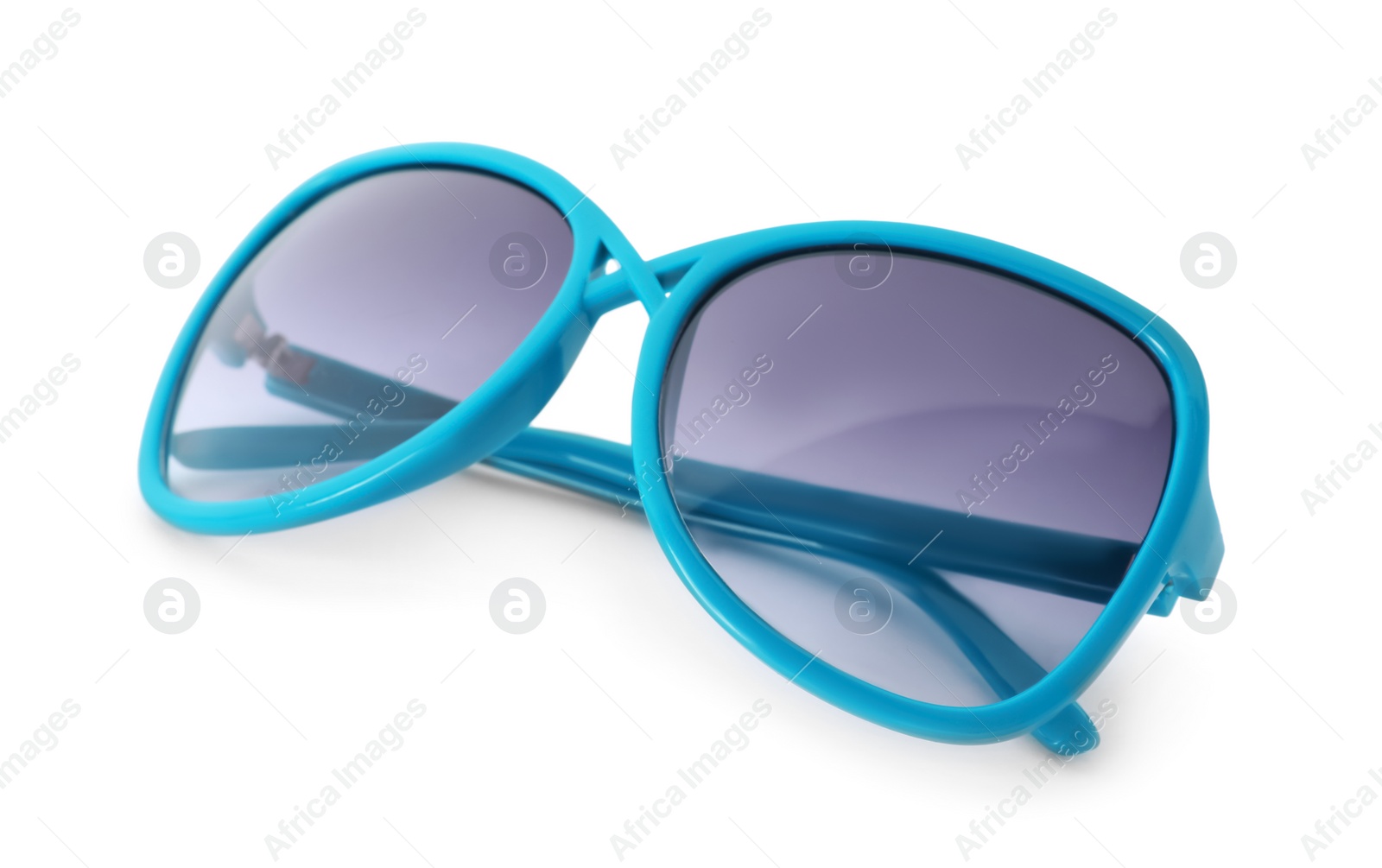 Photo of Beautiful sunglasses on white background. Beach object