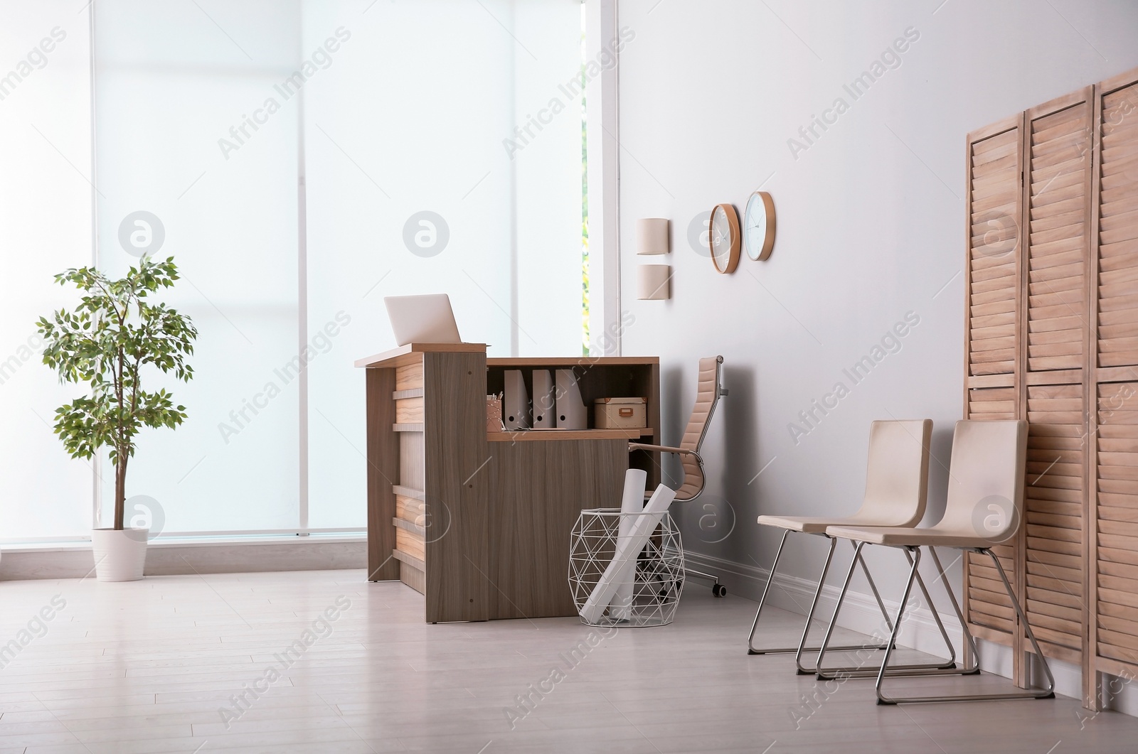 Photo of Hotel lobby interior with wooden reception desk