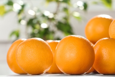 Photo of Fresh juicy oranges on table, space for text. Healthy fruits