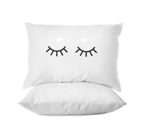 Soft pillows, one with cute face isolated on white 