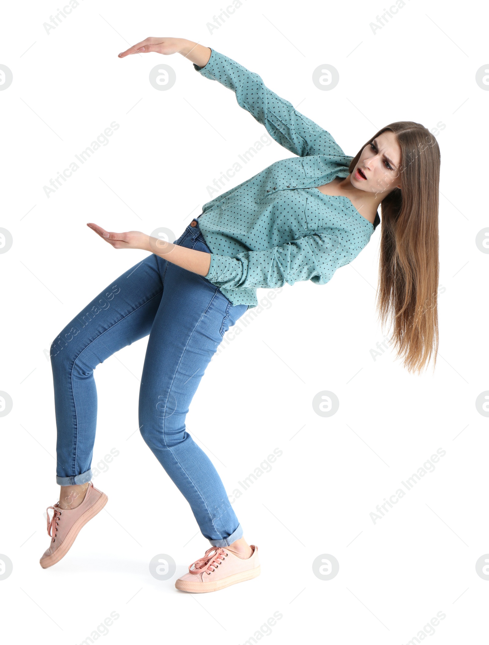 Photo of Young woman with magnet attracting people on white background