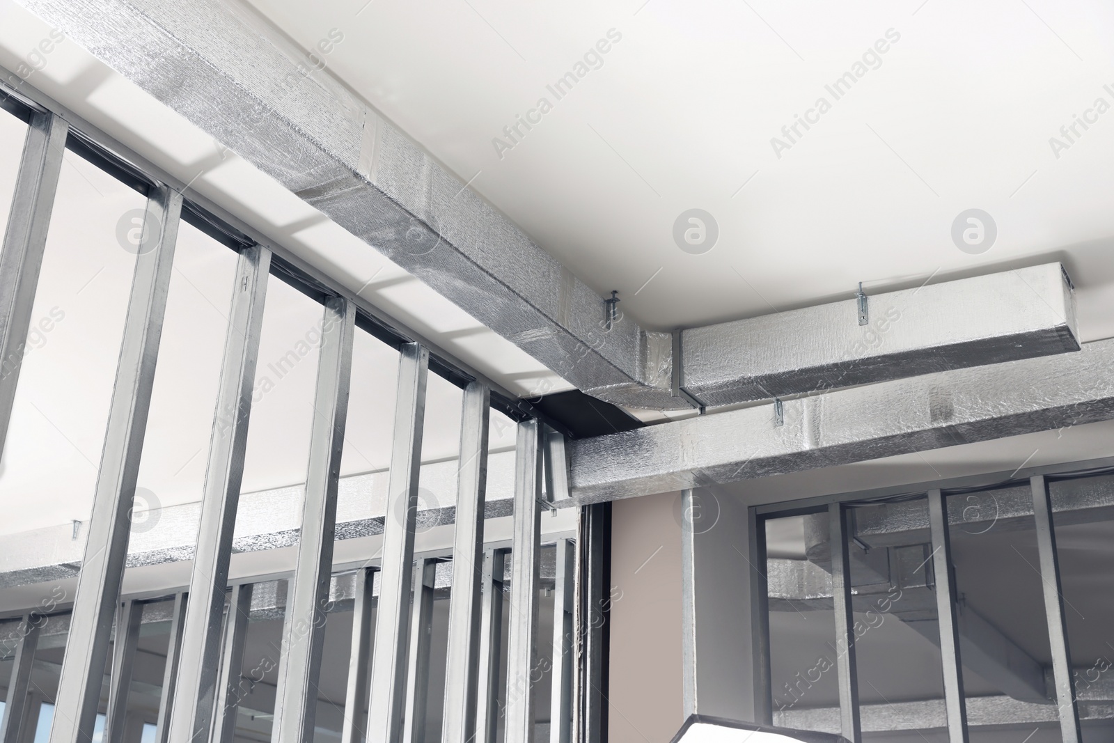 Photo of Ceiling with ventilation system indoors, bottom view