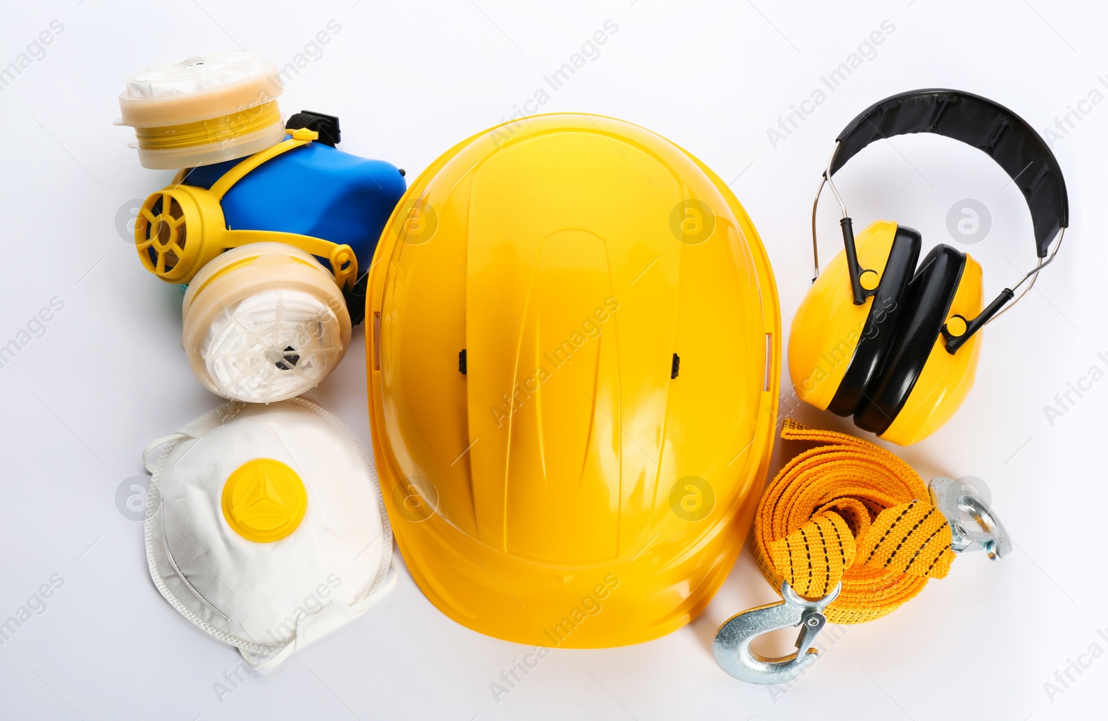 Photo of Set of safety equipment on white background, top view
