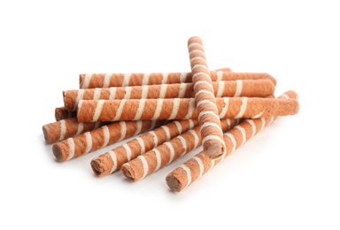 Delicious chocolate wafer rolls on white background. Sweet food