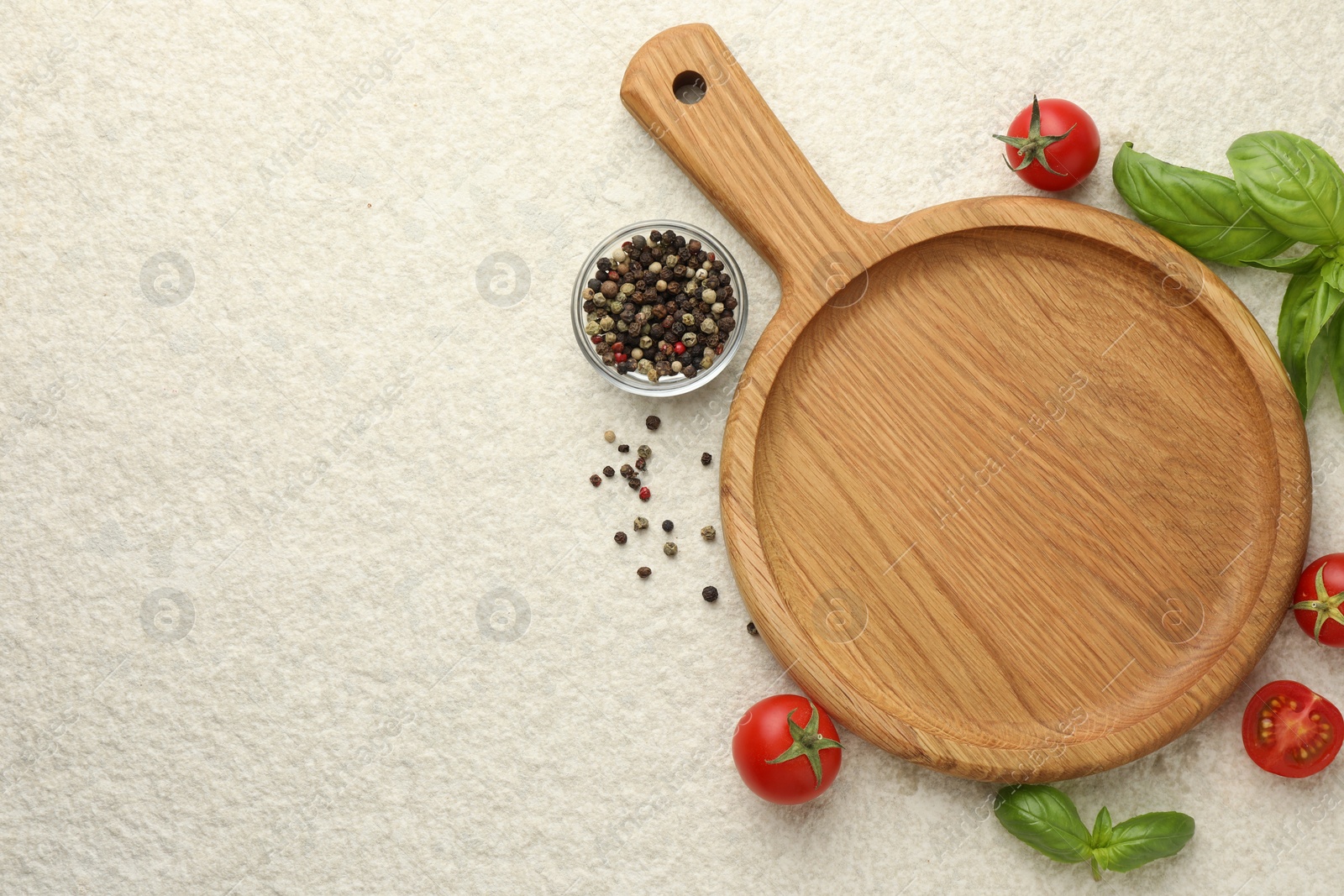 Photo of Cutting board, basil, spices and tomatoes on white textured table, flat lay. Space for text