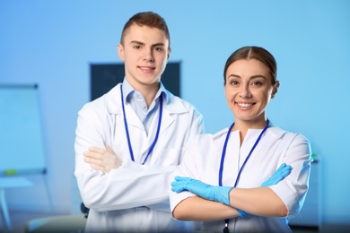 Photo of Portrait of young scientists in chemistry laboratory