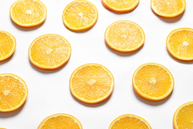 Composition with orange slices on white background