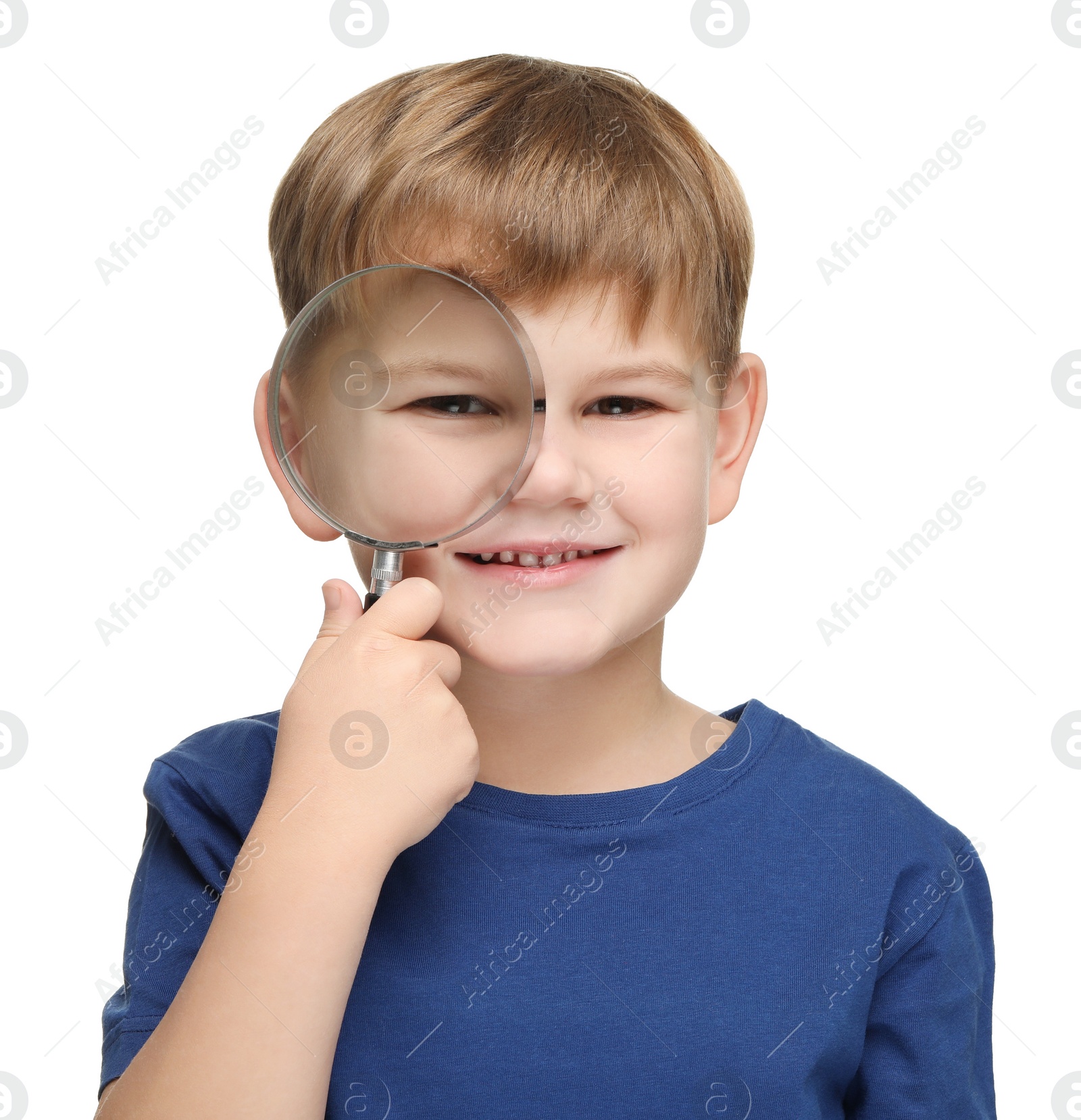 Photo of Little boy with magnifying glass on white background