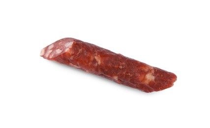 Photo of Piece of thin dry smoked sausage isolated on white, top view