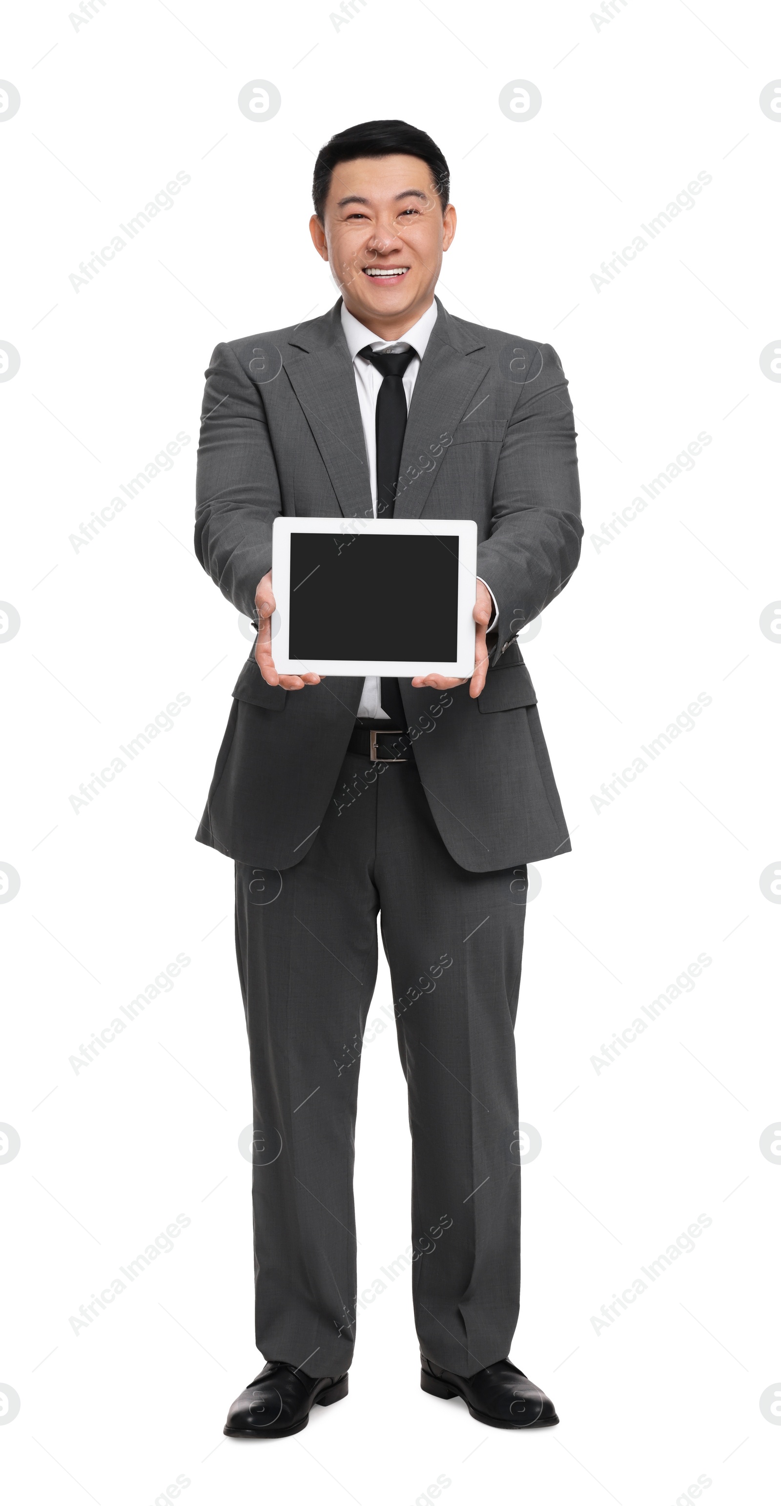 Photo of Businessman in suit showing tablet on white background