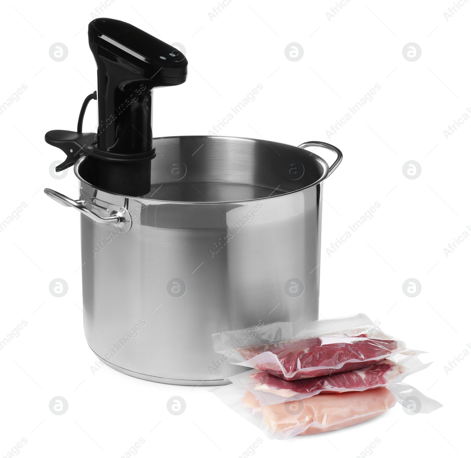 Photo of Thermal immersion circulator in pot and meat on white background. Vacuum packing for sous vide cooking