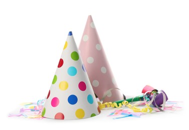 Colorful party hats and other festive items on white background