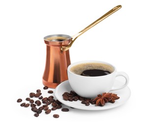 Photo of Copper turkish coffee pot, beans and cup of hot drink on white background