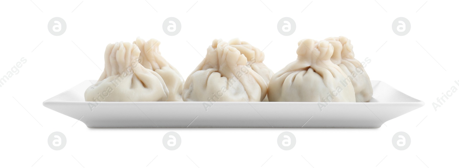 Photo of Plate with tasty fresh khinkali (dumplings) isolated on white. Georgian cuisine