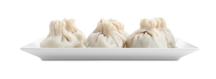 Plate with tasty fresh khinkali (dumplings) isolated on white. Georgian cuisine