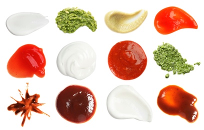 Set with samples of different sauces on white background