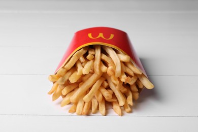 MYKOLAIV, UKRAINE - AUGUST 12, 2021: Big portion of McDonald's French fries on white wooden table